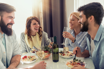 Friends having lunch together at home