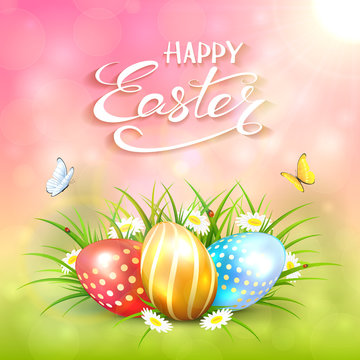 Pink sunny background with Easter eggs in grass