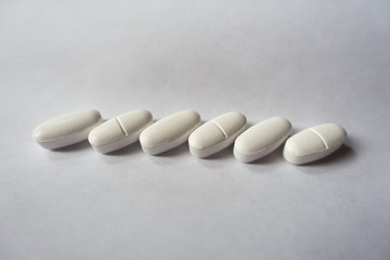 White caplets of calcium citrate in a row