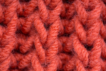 Texture of a knitted wool product, close up.