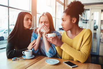 One more picture of sad girls where two of them are trying to support mentally their friend. She is...