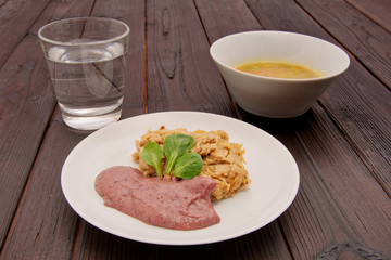 Dumplings with acidic cabbage on a table