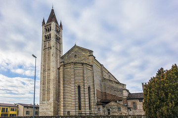 Fototapeta na wymiar View of Basilica di San Zeno Maggiore bell tower in Verona. Basilica di San Zeno Maggiore - most important medieval church in Verona, was founded in V century and rebuilt in XII century. Italy.