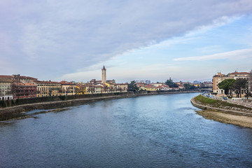 Fototapeta na wymiar Beautiful panorama of Adige River waterfront in Verona, Italy.