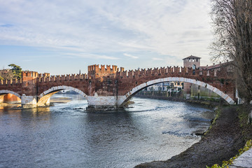 View of Castel Vecchio Bridge (Ponte di Castel Vecchio or Ponte Scaligero, 1354 - 1356) - fortified bridge over the Adige River in Verona, Italy.