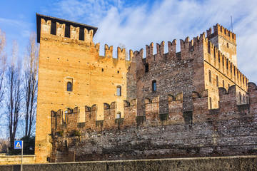 Architectural Details of Old Castle (Castelvecchio) at sunrise in Verona. Castelvecchio was constructed on banks of Adige by Cangrande II della Scala in 1354 in order to defend Verona people. Italy.
