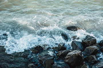 Powerful Waves impact rocky reef at sea coast