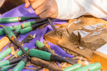 Thai Craftsman carving wood making wooden handicraft arts object