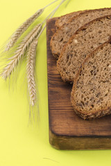rye bread with sunflower seeds on a wooden board. 
