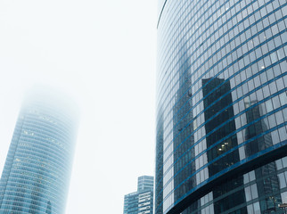 Obraz na płótnie Canvas Glass facades of modern skyscrapers at business district