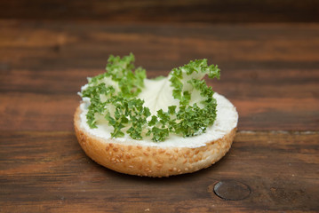 Step by Step Cooking process of Hamburger . Half Burger with Fresh Letuce leave, Homemade Healthy with fresh Vegetables on rustic Wooden Background.