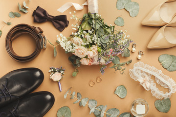 Fototapeta na wymiar Top view of bride and groom shoes