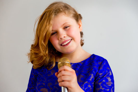 Girl singing with a microphone