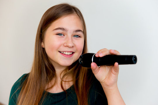 Girl singing with a microphone