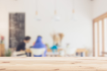 Wood Table top with blur cafe white clean day background space for display coffee products.