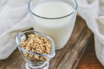 sesame milk sesame seed in a glass on wooden background, concept of healthy eating, organic food, gluten-free and aslacton vegetable milk.