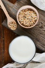 sesame milk sesame seed in a glass on wooden background, concept of healthy eating, organic food, gluten-free and aslacton vegetable milk.