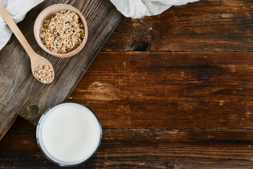 sesame milk sesame seed in a glass on wooden background, concept of healthy eating, organic food, gluten-free and aslacton vegetable milk.