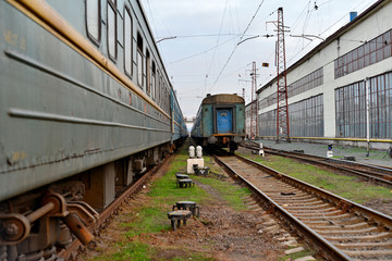 Fototapeta premium Passenger and freight train. Passenger diesel train traveling speed railway wagons journey light