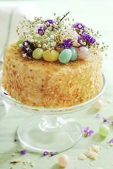Homemade Coconut Cake With Easter Candies decoration, selective focus