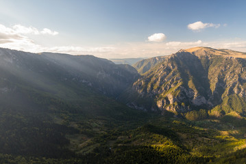 Beautiful golden light is shining on the mountains in Durmitor National park in Montenegro.