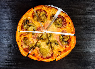 pizza on a dark wooden background