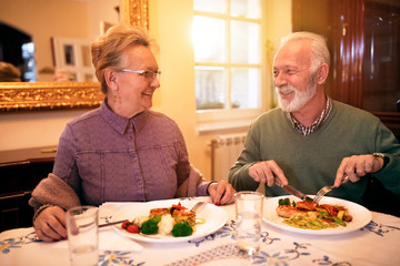 Senior lovely couple eating healthy lunch at nursing home
