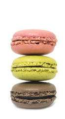 Stack of three multicolored macaroons, pink, green and brown cake isolated on a white background. Chocolate, pistachio and strawberry or raspberry french sweets