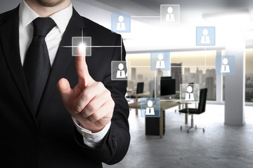 businessman in modern office with social network structure management concept