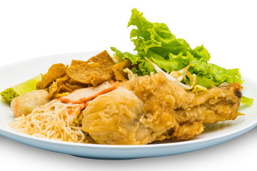 Dry egg noodle topping with fried chicken drumstick, bean sprout, red pork, crispy wonton, lemon grass and vegetable