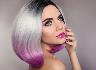 Fototapeta premium Ombre hairstyle. Beauty makeup and manicure nails. Colored blonde bob short hair style. Portrait of glamour woman with purple lipstick and polish nail.