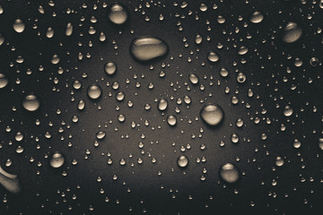 Drops of water on a color background. Gray. Toned