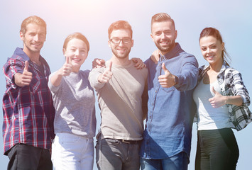 group of young people showing thumb up