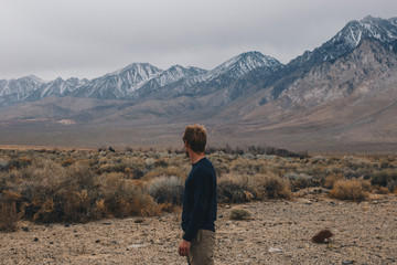 Blonde Man in the Desert and Mountains