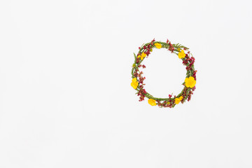 Wreath from summer field flowers on white background, flat lay