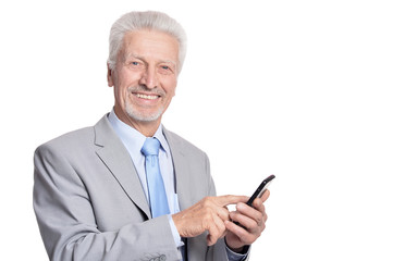 senior businessman posing with smartphone 