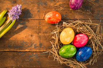 Easter themed background with eggs and flowers