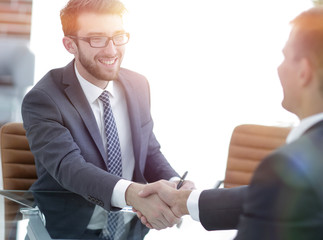 Fototapeta premium welcome and handshake business partners