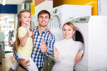 Family choosing washing machine