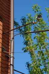 Fototapeta premium CCTV security camera on the wall outside.