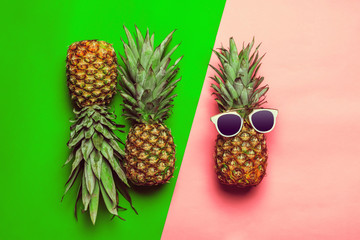 pineapple on colored paper with glasses