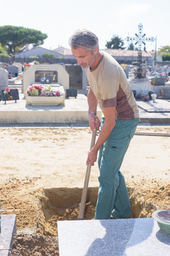 Man preparing grave