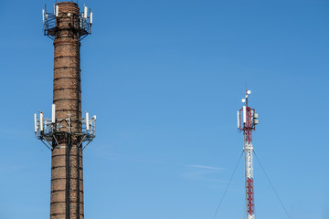 Obraz premium Old brick chimney turn into cellular tower.