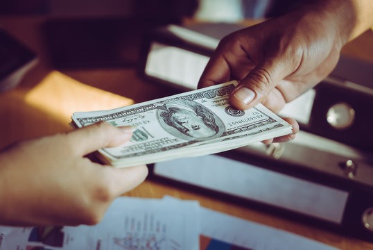 Business Man Hands Handing Money Over A Business Dealing