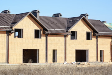 Cottages in the process of construction Wooden arch roof. Roof under construction