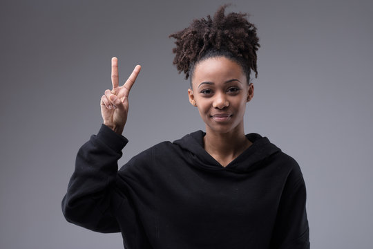 victory sign by beautiful afroamerican woman