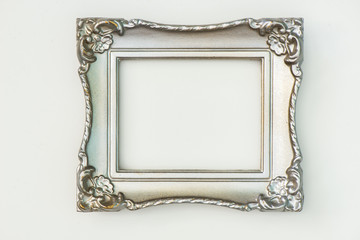 Silver painted frame with gold peeking through on white