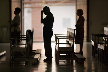 Silhouette of worshippers at church