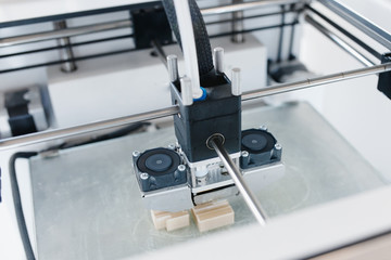 3D printer. Modern 3D printer printing figure home close-up macro