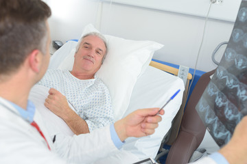 cheerful doctor gives good news to patient